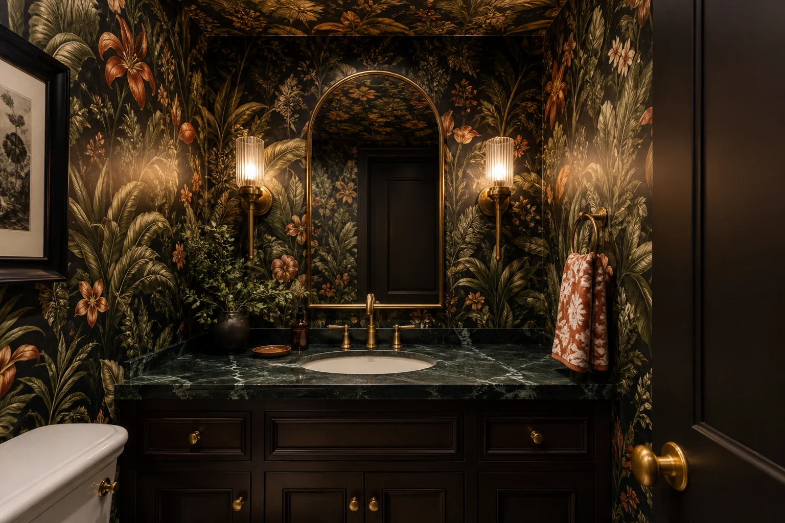 A small powder room fully wallpaper-drenched in a rich botanical print on walls and ceiling, with brass fixtures and warm lighting, feeling jewel-box intimate